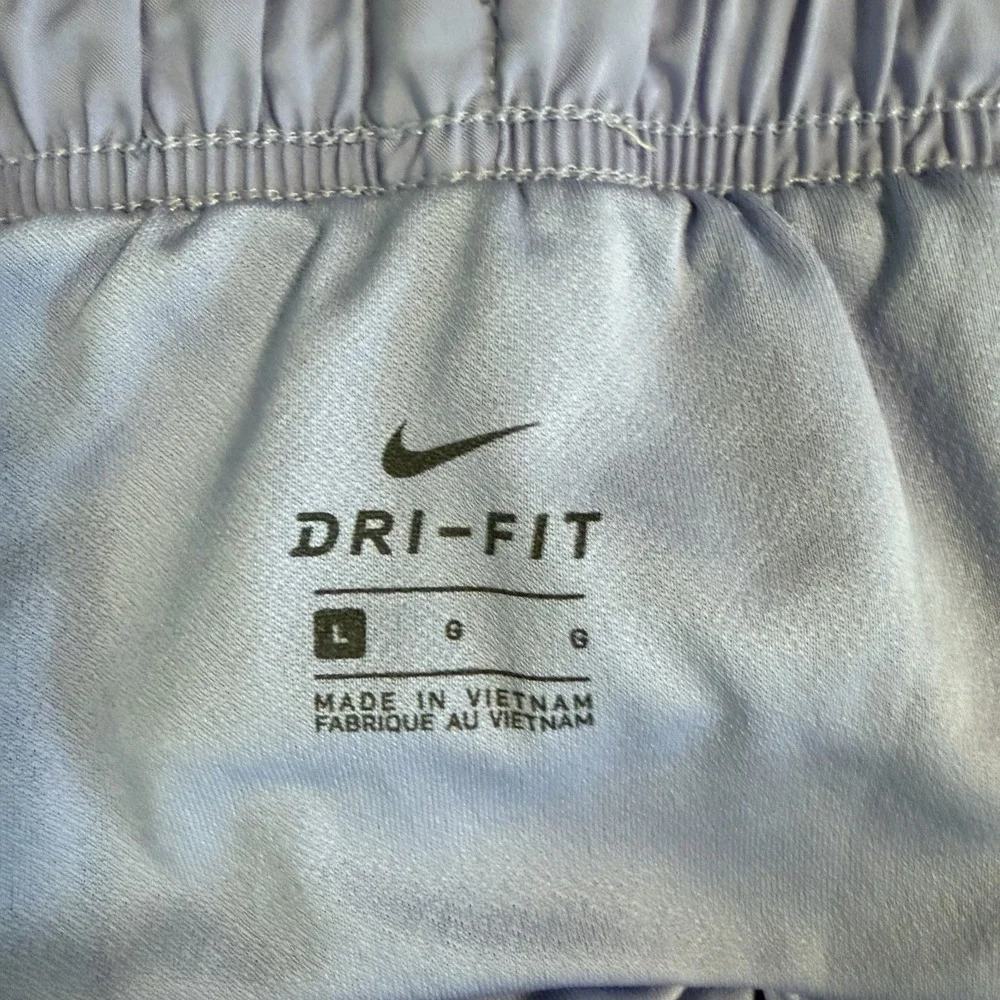 Nike‎ Dri-FIT Tempo Womens Running Shorts Tan Purple Trim Size L 3 Inch Inseam